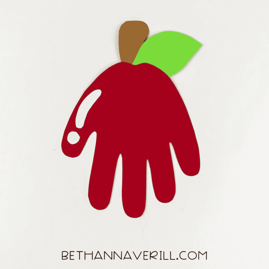 White highlight shape glued on the left side of the handprint.