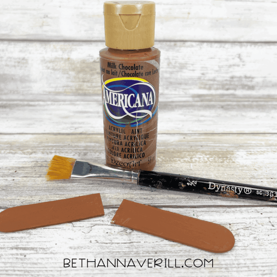 Brown paint and brush used to paint the small stem pieces.