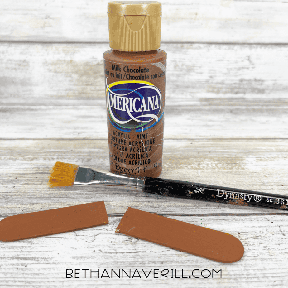 Brown paint and brush used to paint the small stem pieces.