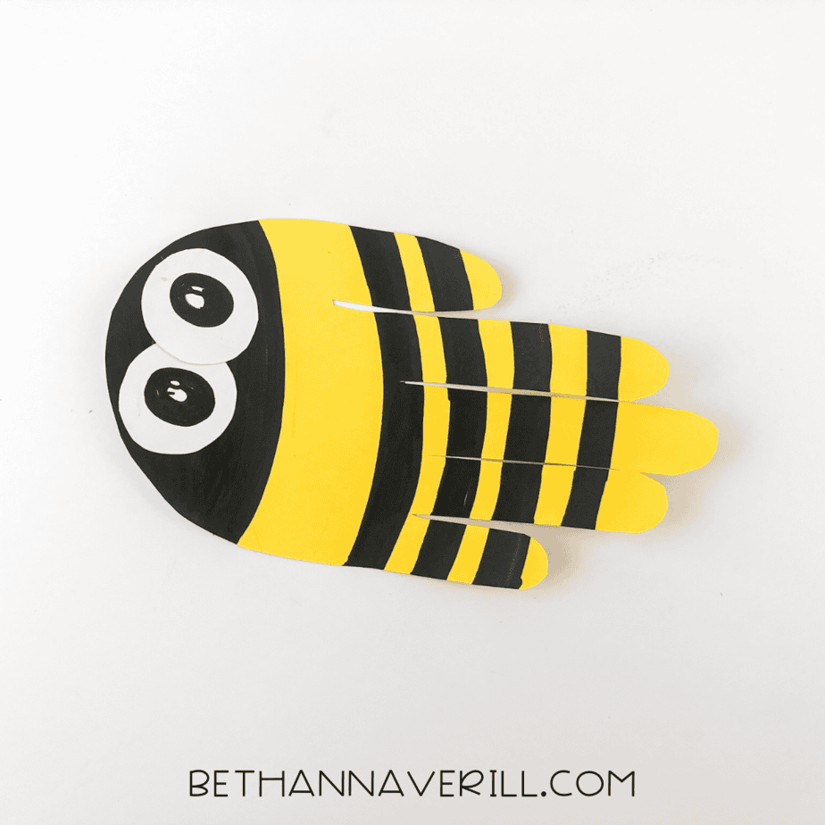 Pupils drawn onto the eyes to bring the bee to life.