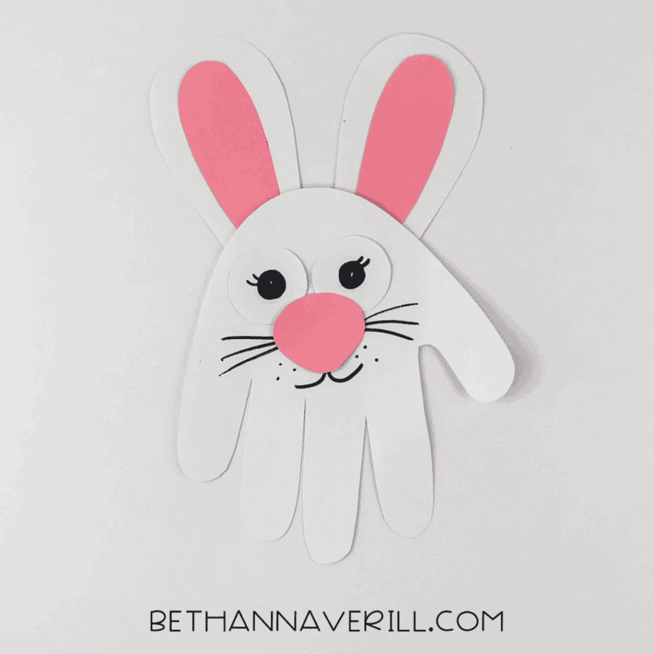 Finished bunny handprint craft with all details added.