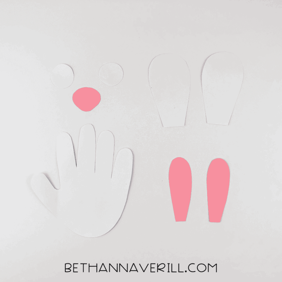 All bunny pieces cut out: handprint, eyes, ears, and nose.
