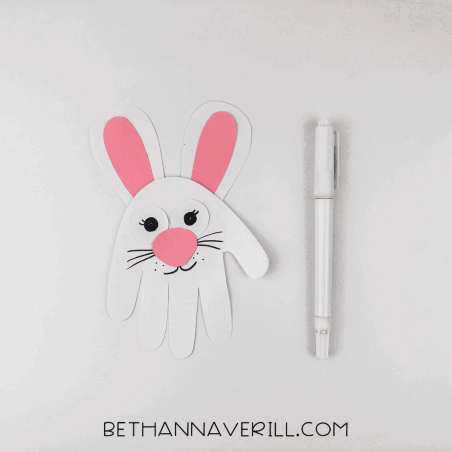 black marker used to draw on whiskers, lashes, and a big smile.