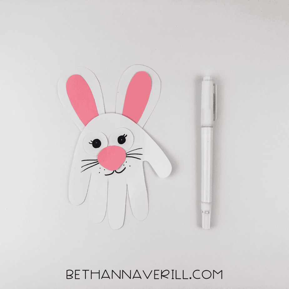 black marker used to draw on whiskers, lashes, and a big smile.