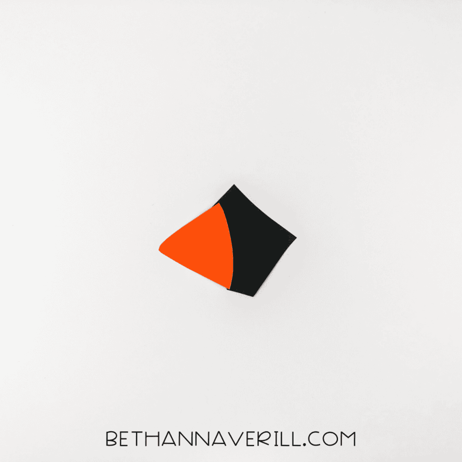 Orange beak glued to black mask piece