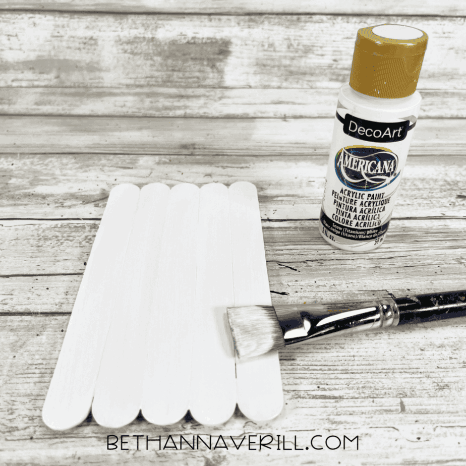 Craft sticks painted white for cow base.