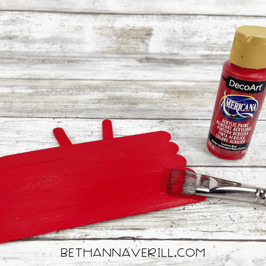 Craft sticks painted red for crab body.