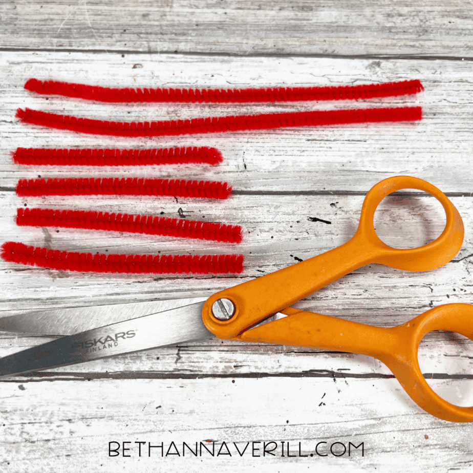 Red pipe cleaners cut for crab legs.