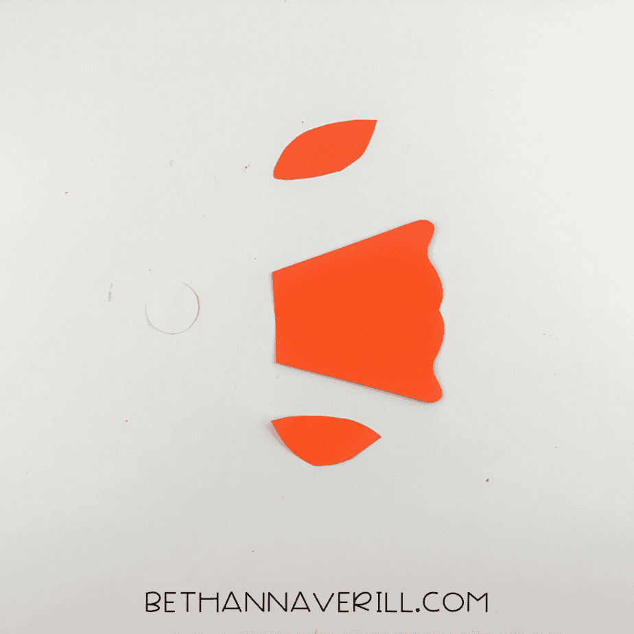 Orange paper fins, tail, and a white circle cut out for the fish craft.