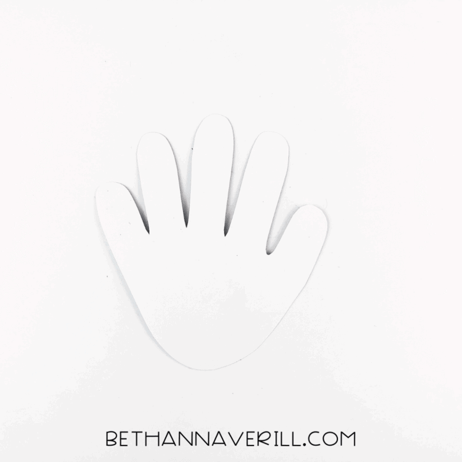 A white handprint cutout