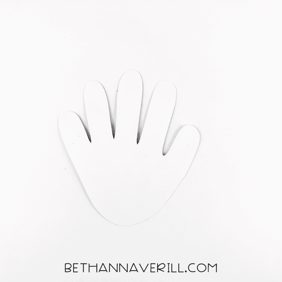 A white handprint cutout