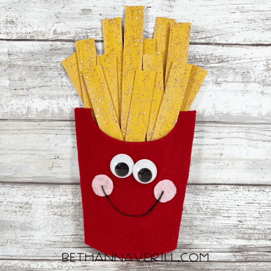 Completed French Fries Popsicle Stick Craft with happy face and smiling fries.