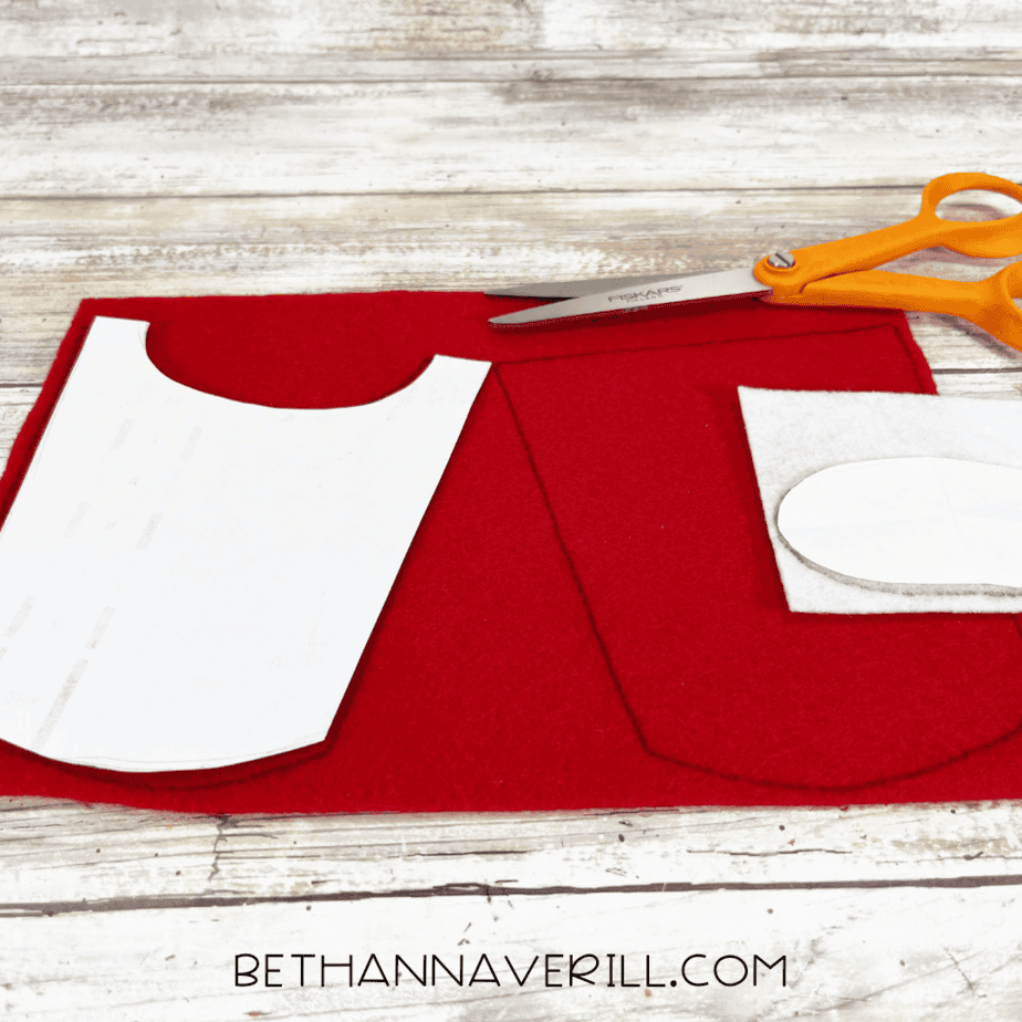 Red felt with templates for the fry container and white oval traced.