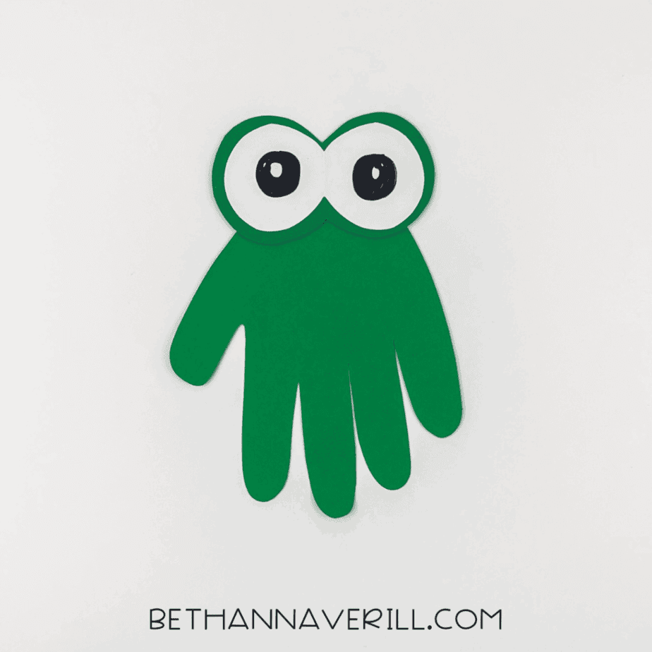 Eyes glued onto the green handprint