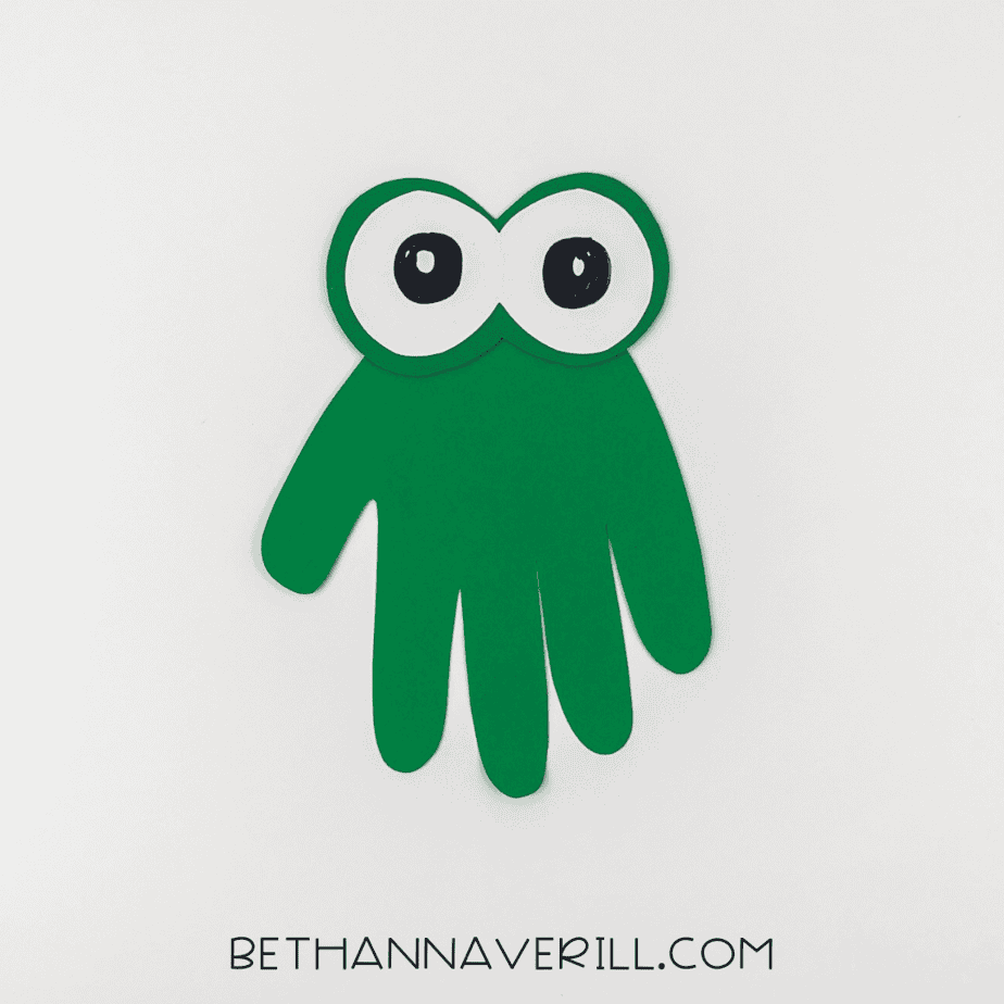 Eyes glued onto the green handprint