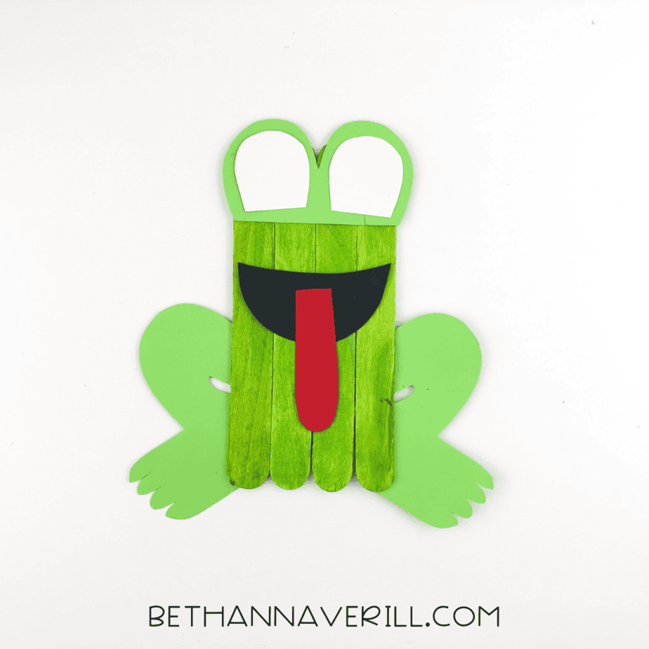 Frog arms and legs added to the popsicle stick base.