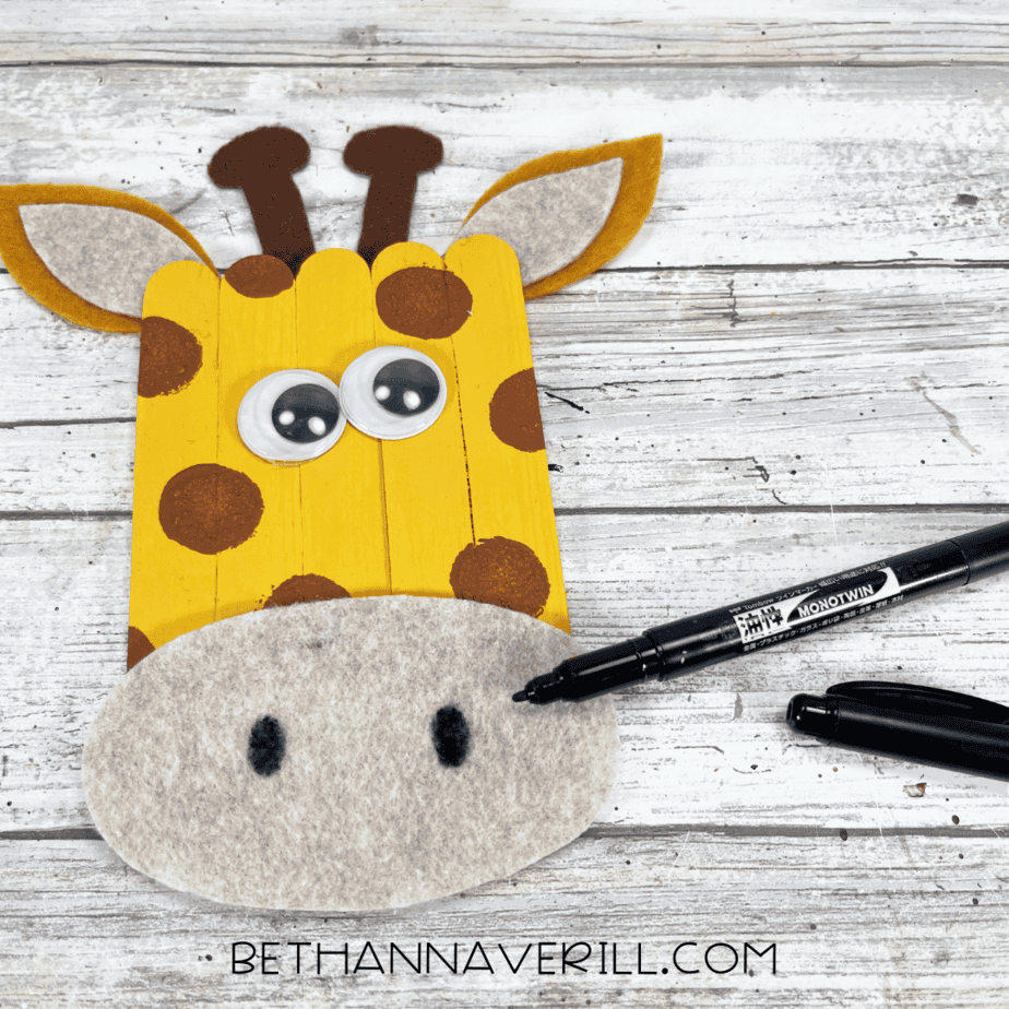 black marker to add details to giraffe