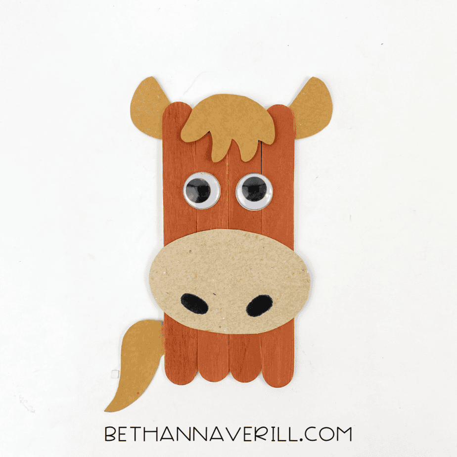Finished popsicle stick horse craft ready for display.