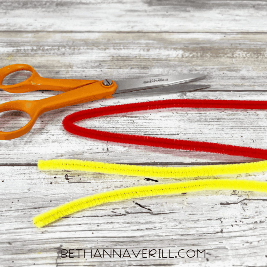 Red and yellow pipe cleaners before cutting for ketchup and mustard