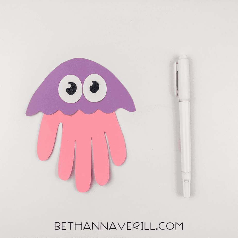 Pupils drawn on eyes with black marker