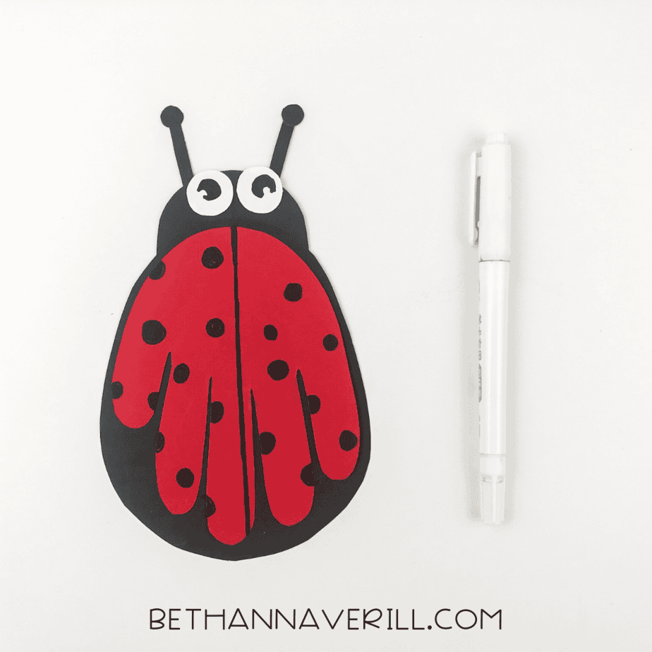 Black spots and line added to red handprint wings