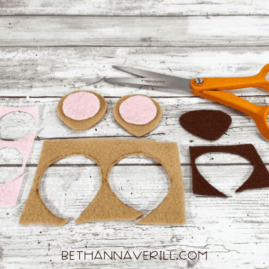 Cut-out felt shapes for ears and nose.