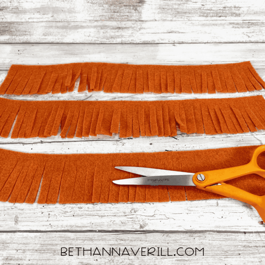 Orange felt strips cut with fringe for the mane.