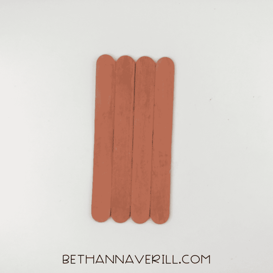 Four brown popsicle sticks glued together for the moose’s face.