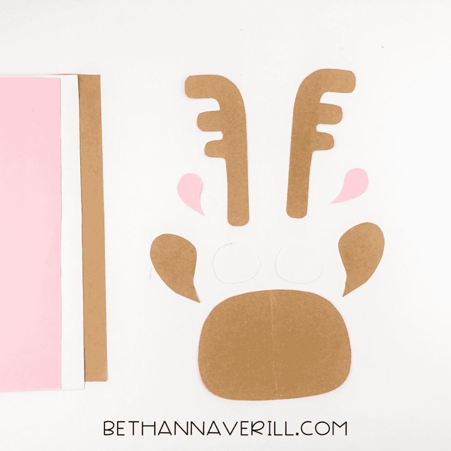 Cut-out shapes for the moose including antlers, ears, eyes, and muzzle.