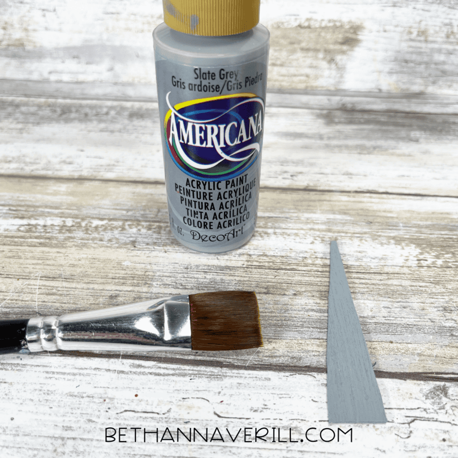 One craft stick triangle painted with slate gray paint for the tusk.