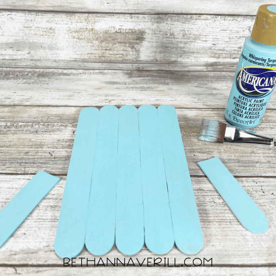 Popsicle stick base and fins painted whispering turquoise.