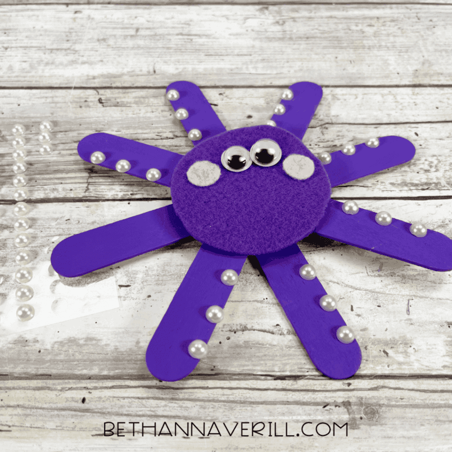 Octopus decorated with pearls on legs.