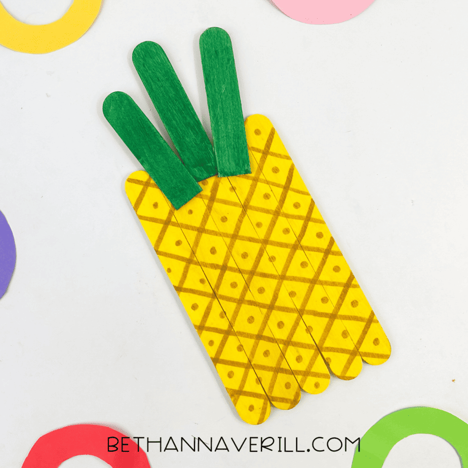Completed pineapple popsicle stick craft shown from above.