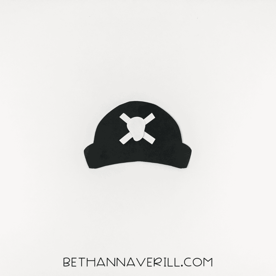 Pirate hat assembled with white skull and crossbones decoration.