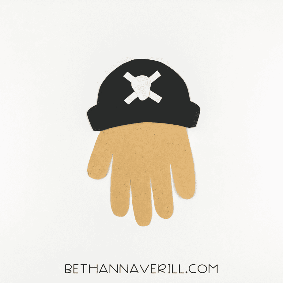 Tan handprint with pirate hat glued to the top.