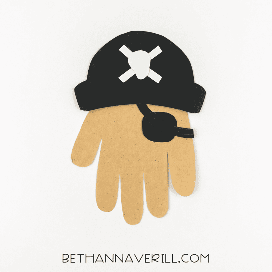 Black eye patch added across the handprint’s “face.”