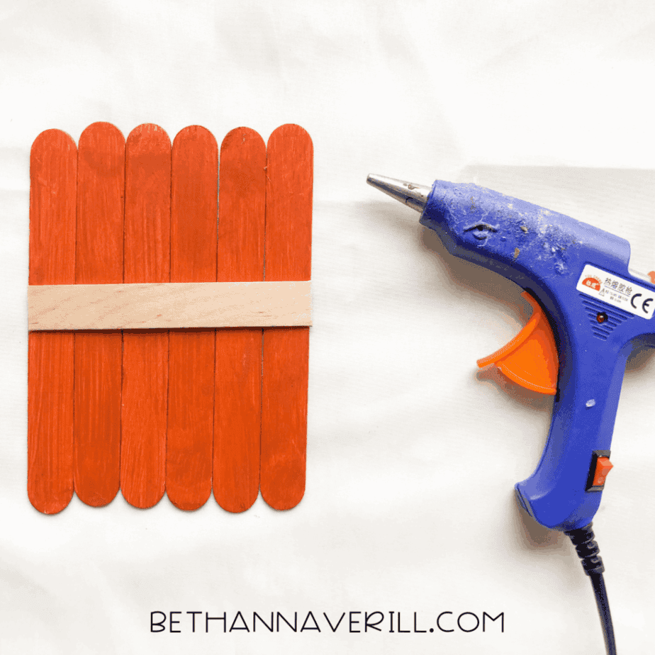 pumpkin popsicle stick craft base glued together