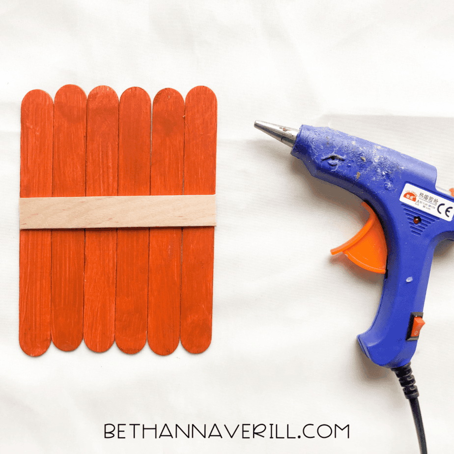 pumpkin popsicle stick craft base glued together
