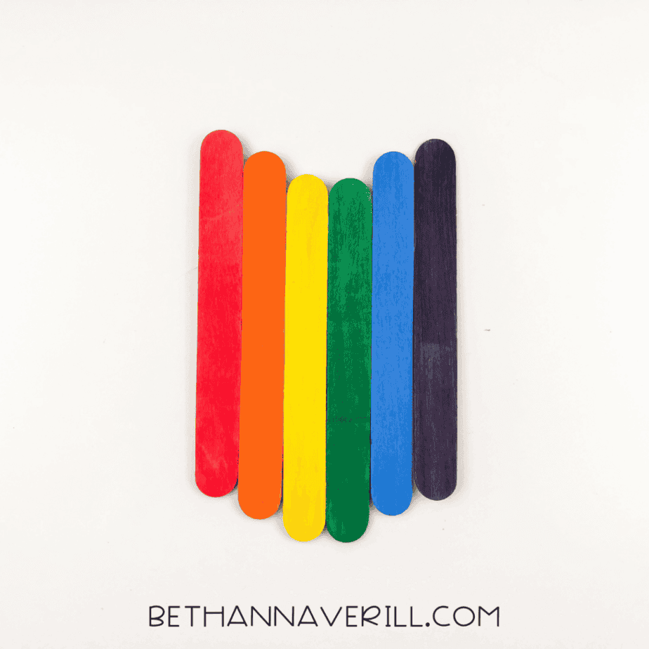 Rainbow sticks lined up in order.