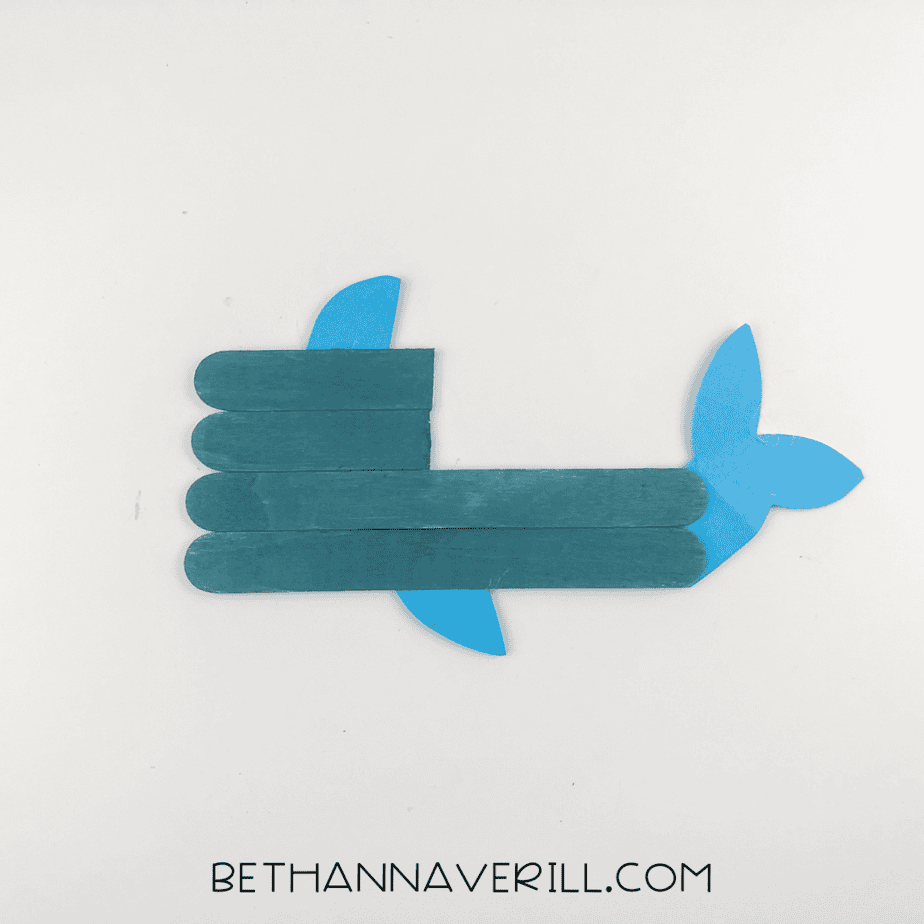 Tail and fins glued to the popsicle stick body.