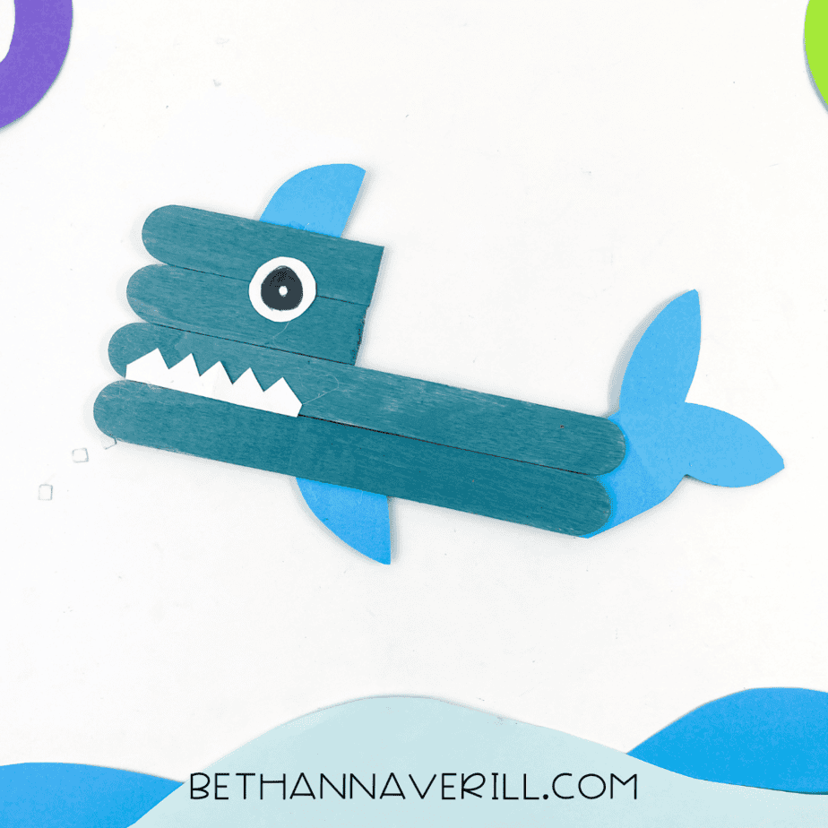 Completed shark craft displayed on a blue background.