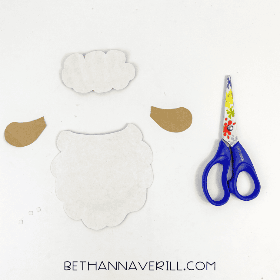 Template pieces cut out for the sheep’s head, fluff, and ears