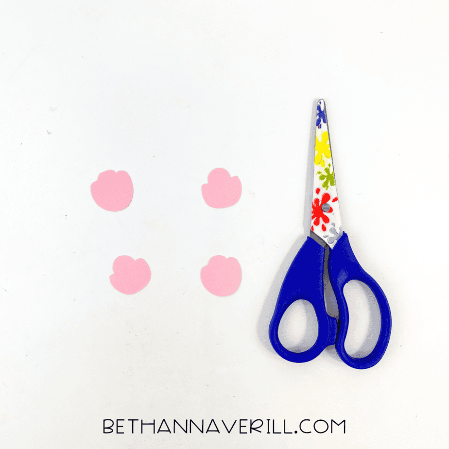 Pink hoof shapes cut out and scissors beside them