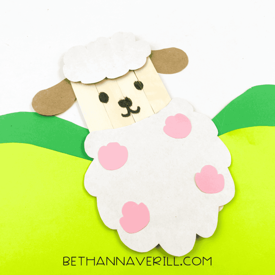 Finished sheep displayed on green construction paper