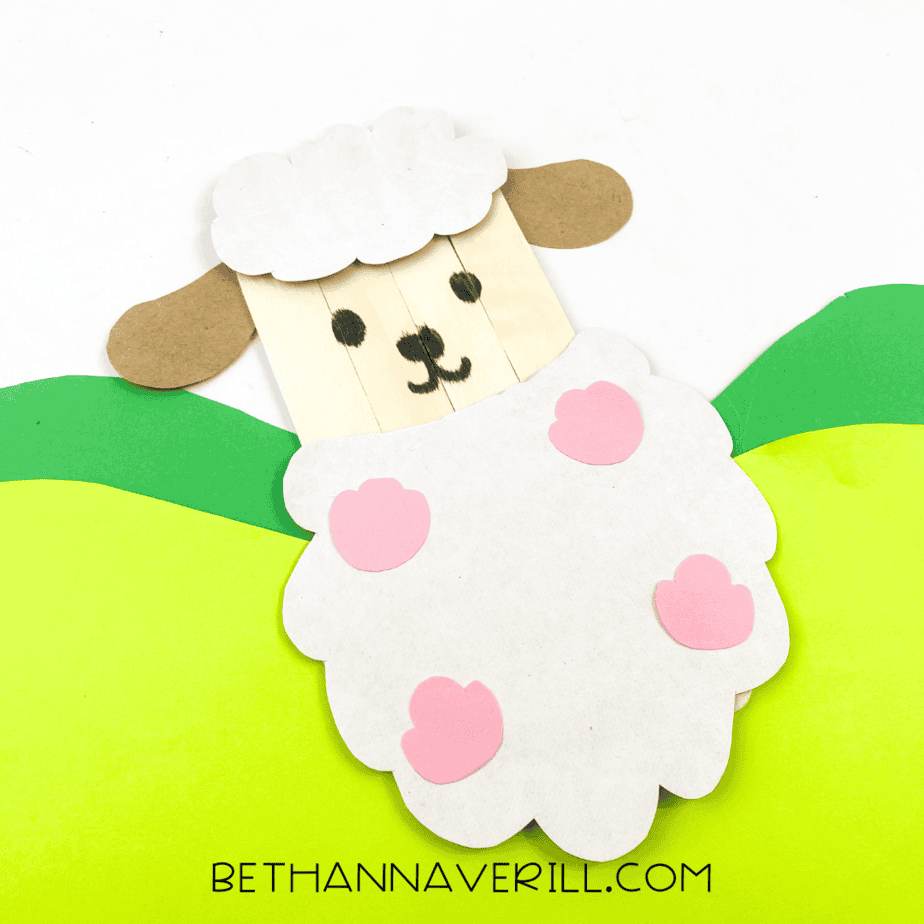 Finished sheep displayed on green construction paper