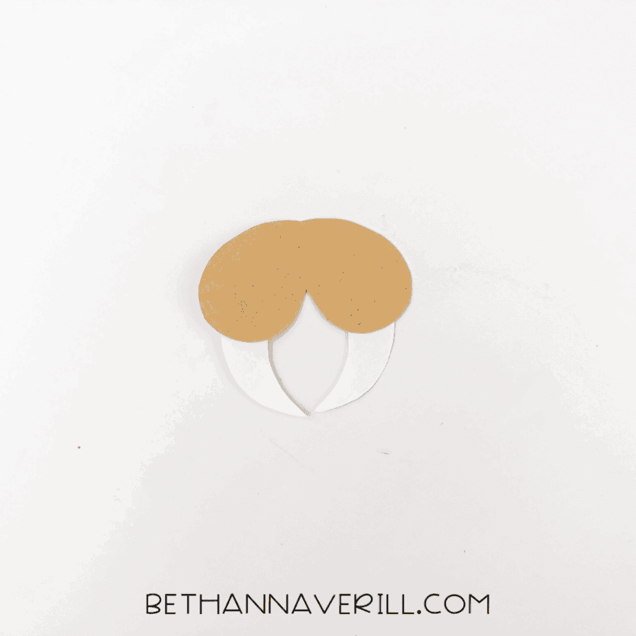 Cheeks and tusks assembled separately on white background.