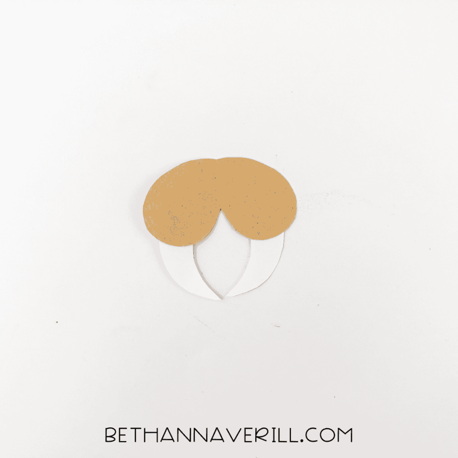 Cheeks and tusks assembled separately on white background.
