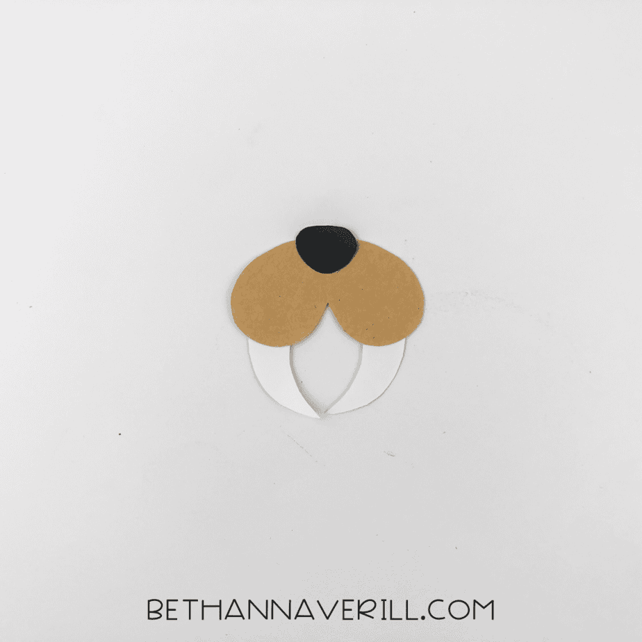 Black nose added to top center of assembled cheeks and tusks.