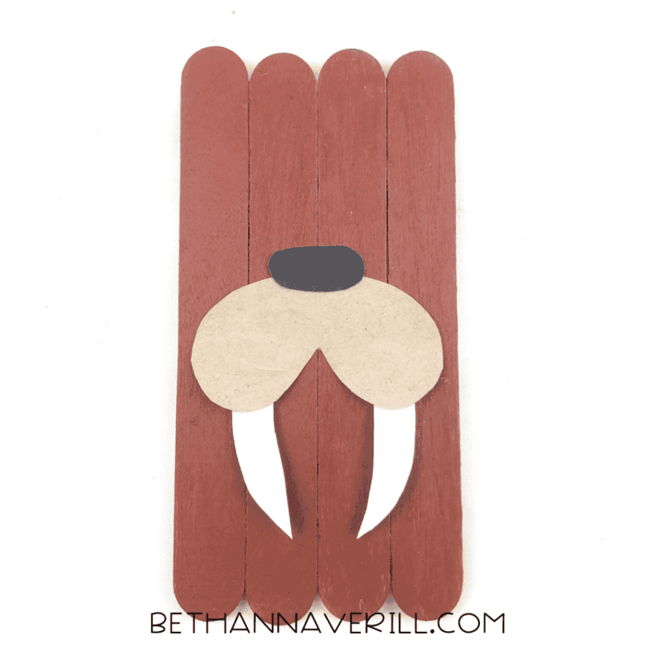 Snout and tusks glued onto the brown popsicle stick base.