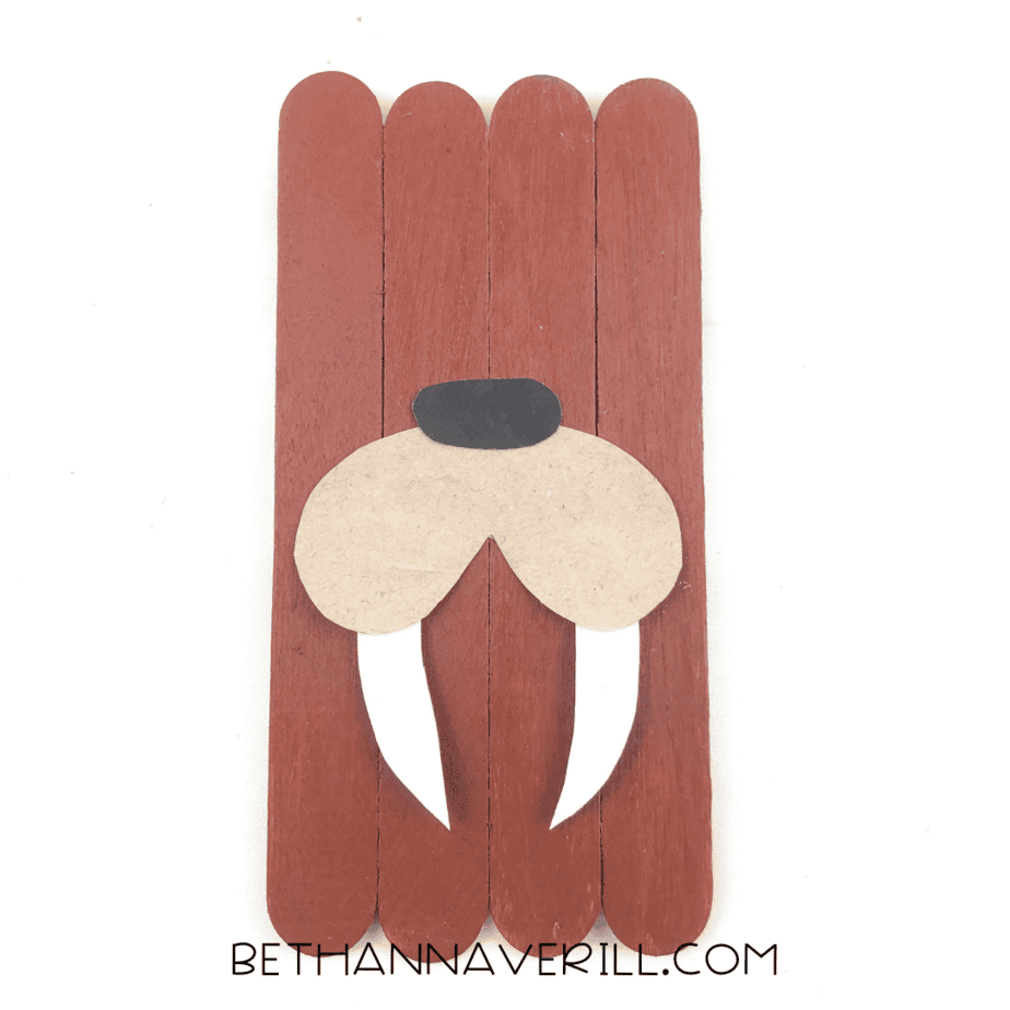 Snout and tusks glued onto the brown popsicle stick base.